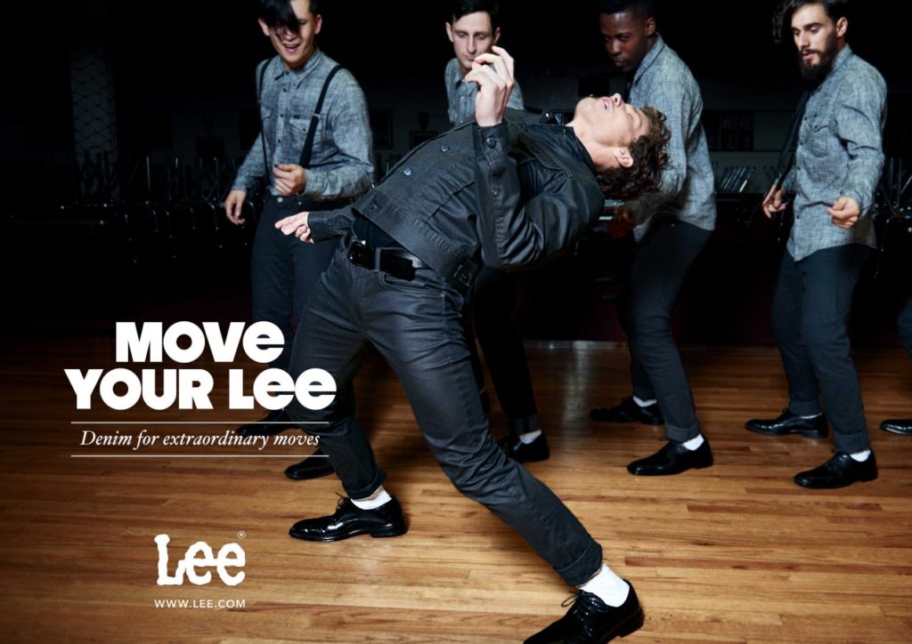 Young man dancing in a lee jeans outfit